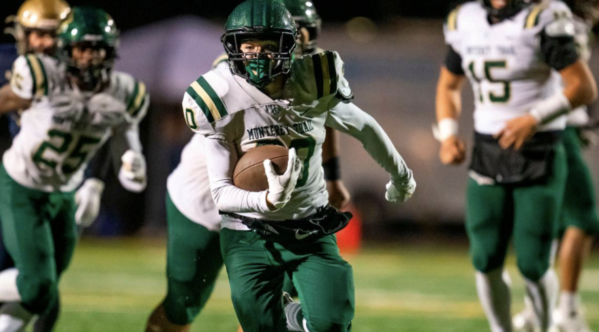 The Monterey Trail Mustangs’ Gabe Coronado (30) breaks loose for the go-ahead 32-yard touchdown against the Elk Grove Thundering Herd in the fourth quarter on Friday.